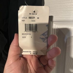 Brand new/never worn stunning fitted long dress with cutouts